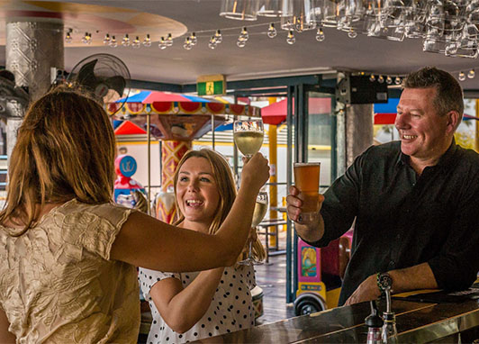 Friends enjoy drinks at a bar.