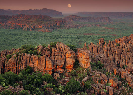 Dramatic rock canyons stretching to the horizon.