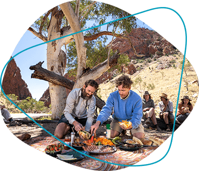 Friends share a meal outdoors.